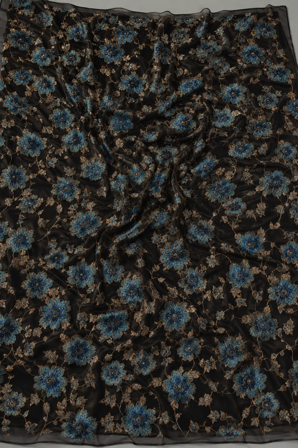 Black floral unstitched material with gold accents