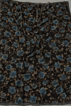 Black floral unstitched material with gold accents