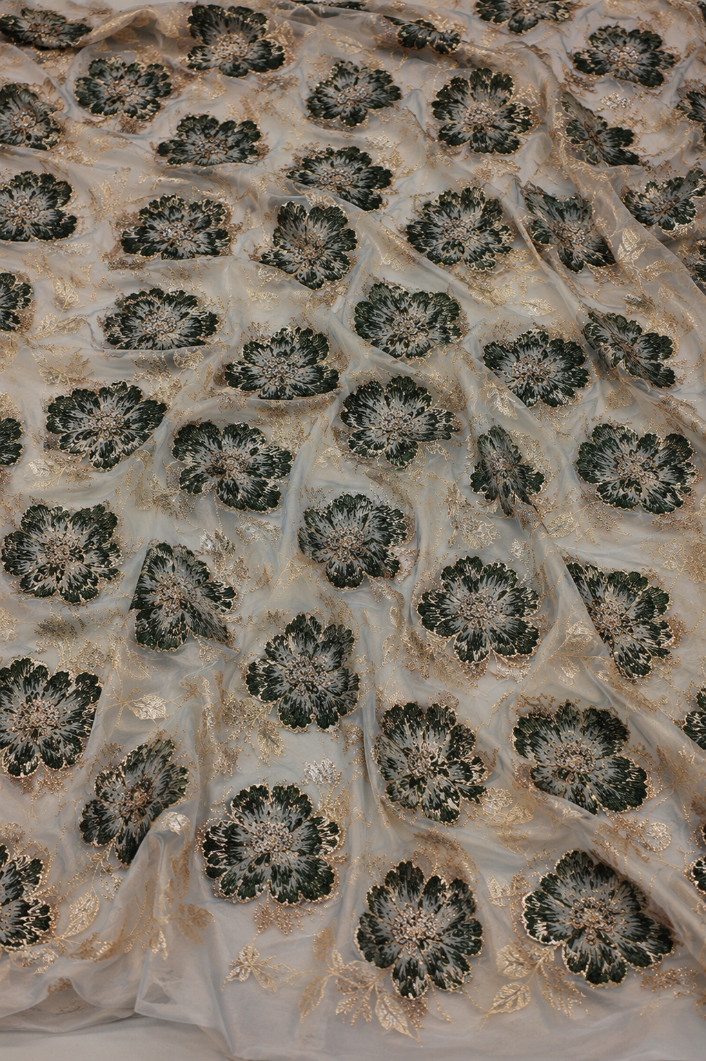 Green floral unstitched material with gold accents