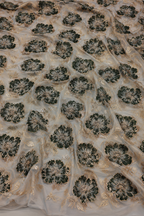 Green floral unstitched material with gold accents