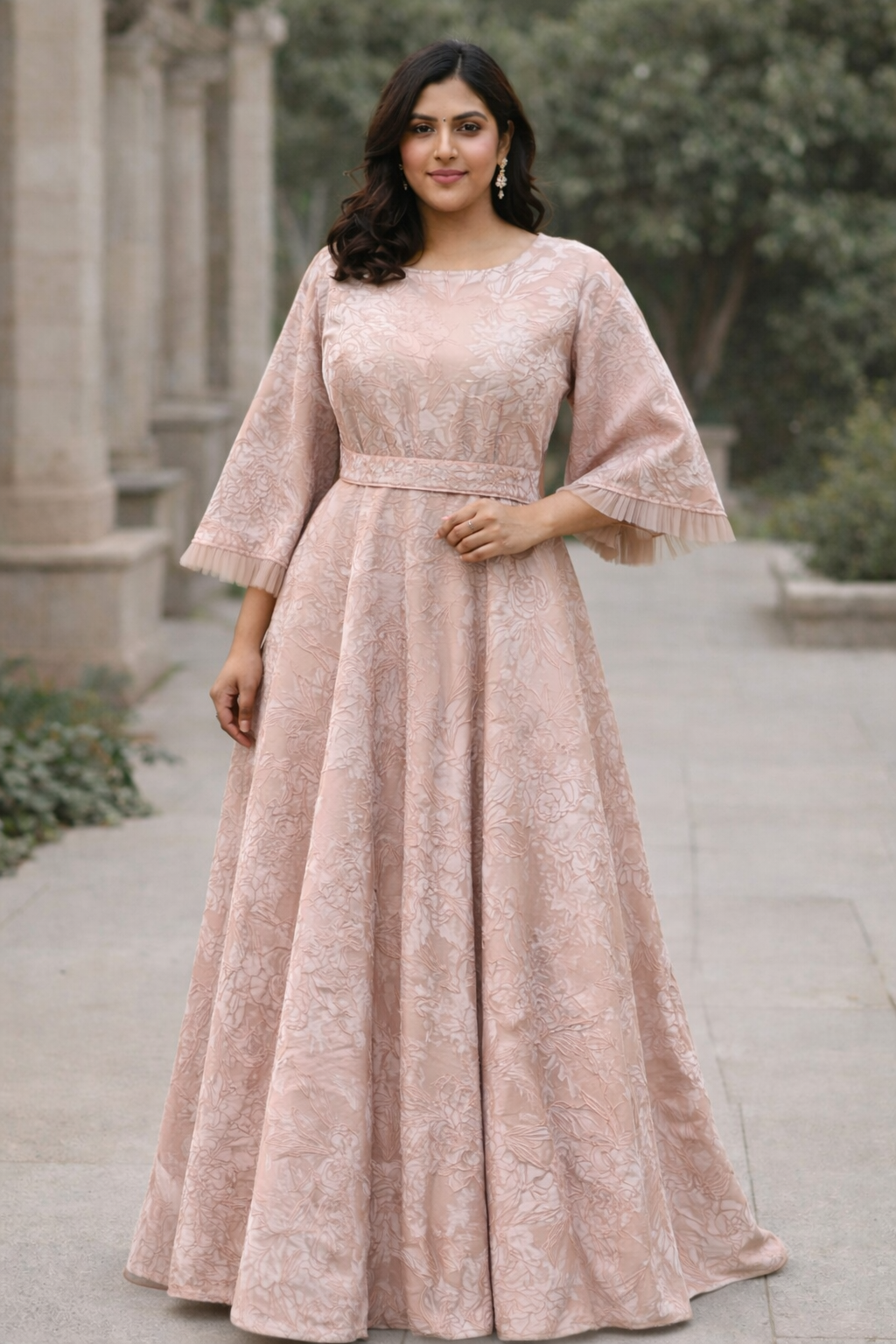 Blush pink Curve with floral design and funnel sleeves jacquard gown