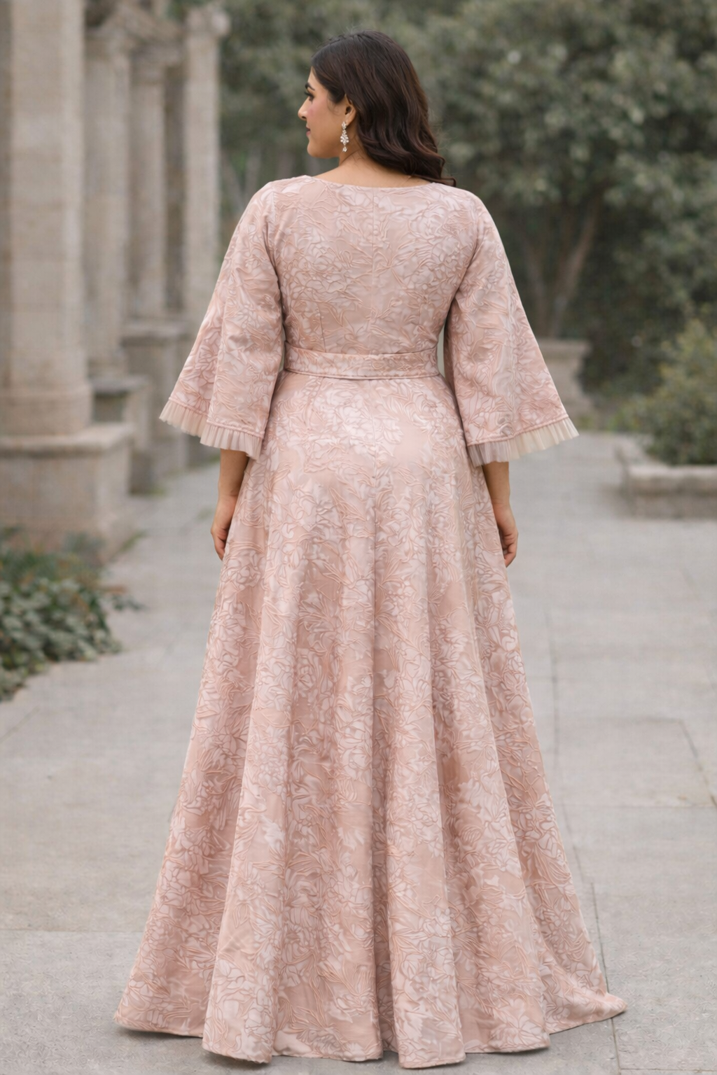 Blush pink Curve with floral design and funnel sleeves jacquard gown