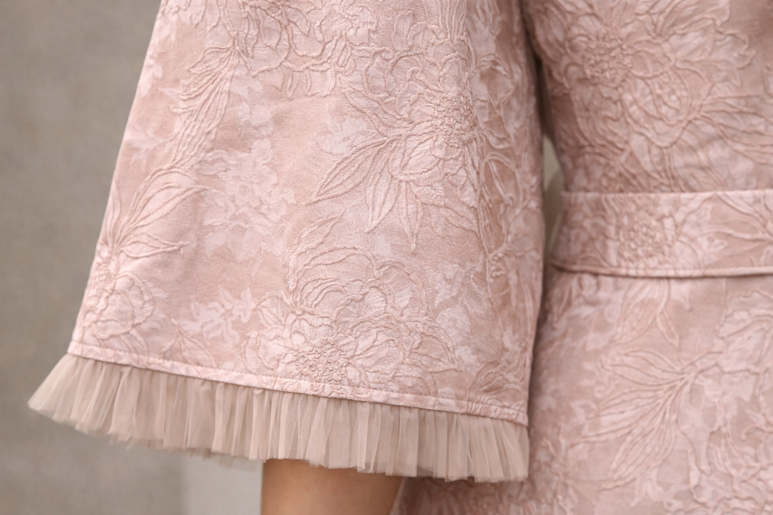 Blush pink Curve with floral design and funnel sleeves jacquard gown