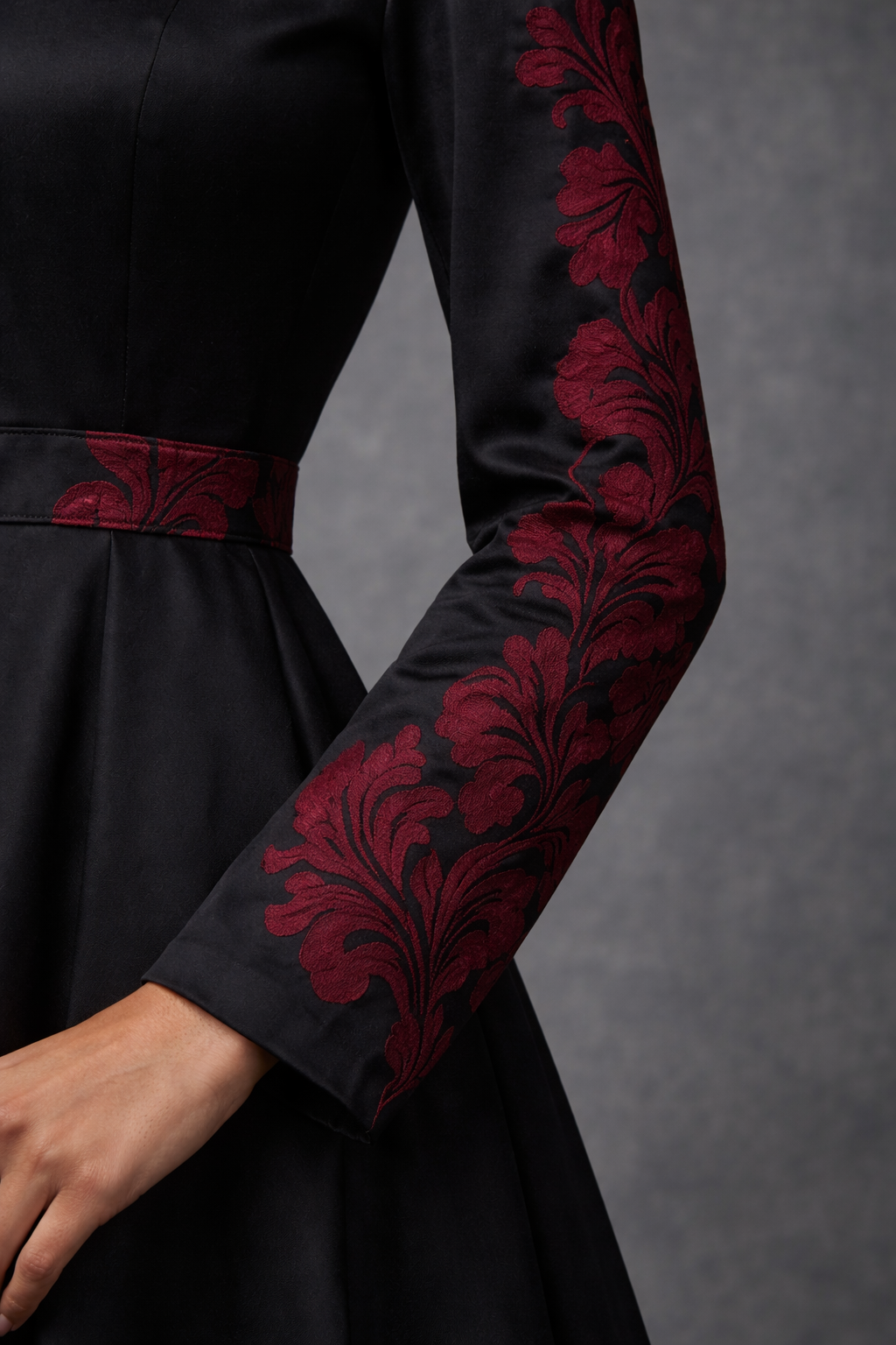 Black satin dress with red floral embroidery on the sleeves - Pre Order