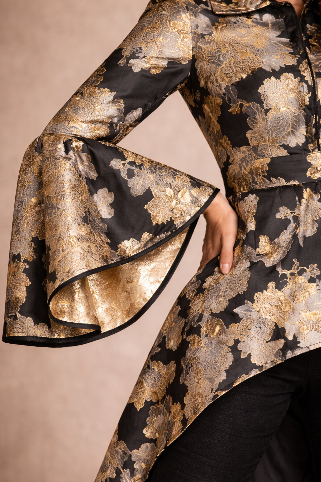 Black with accents of gold and silver Jacquard asymmetrical jacket with straight pants and bell sleeves