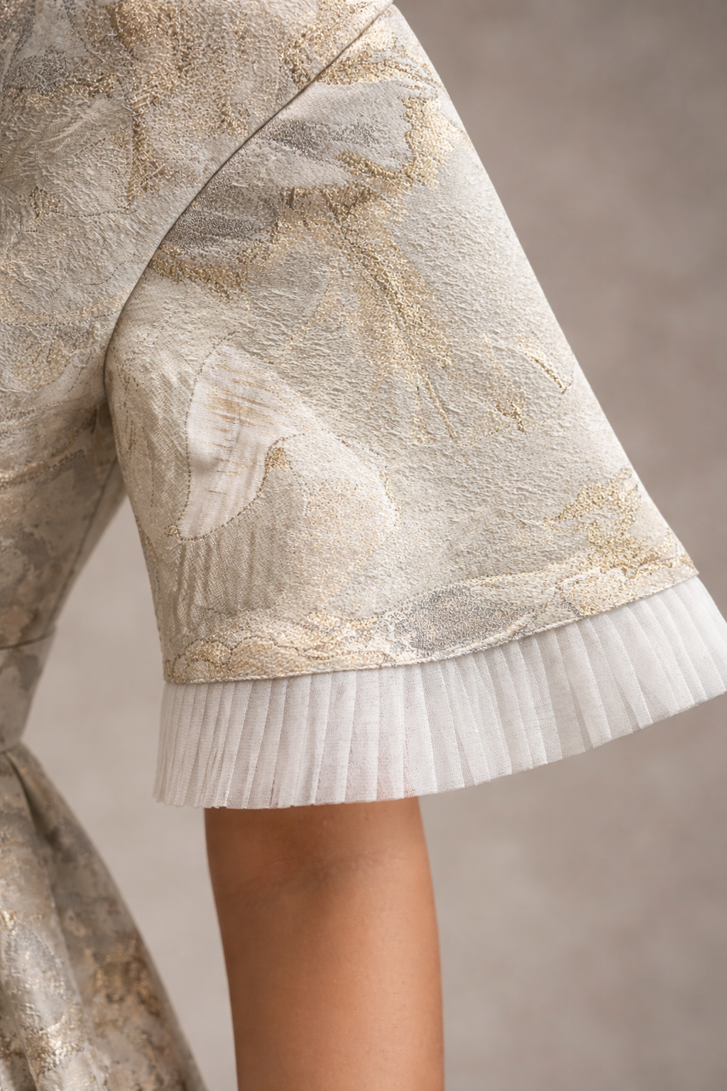 Kids white and gold jacquard gown with funnel sleeves