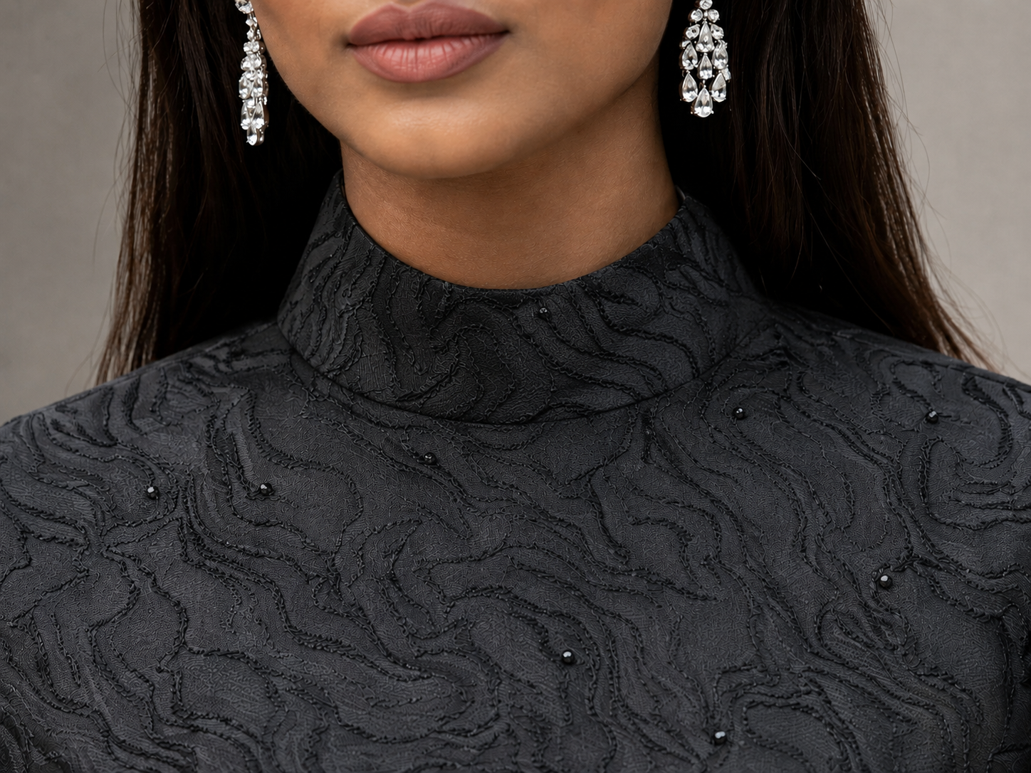 Matte black jacquard gown with funnel sleeves