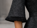 Matte black jacquard gown with funnel sleeves